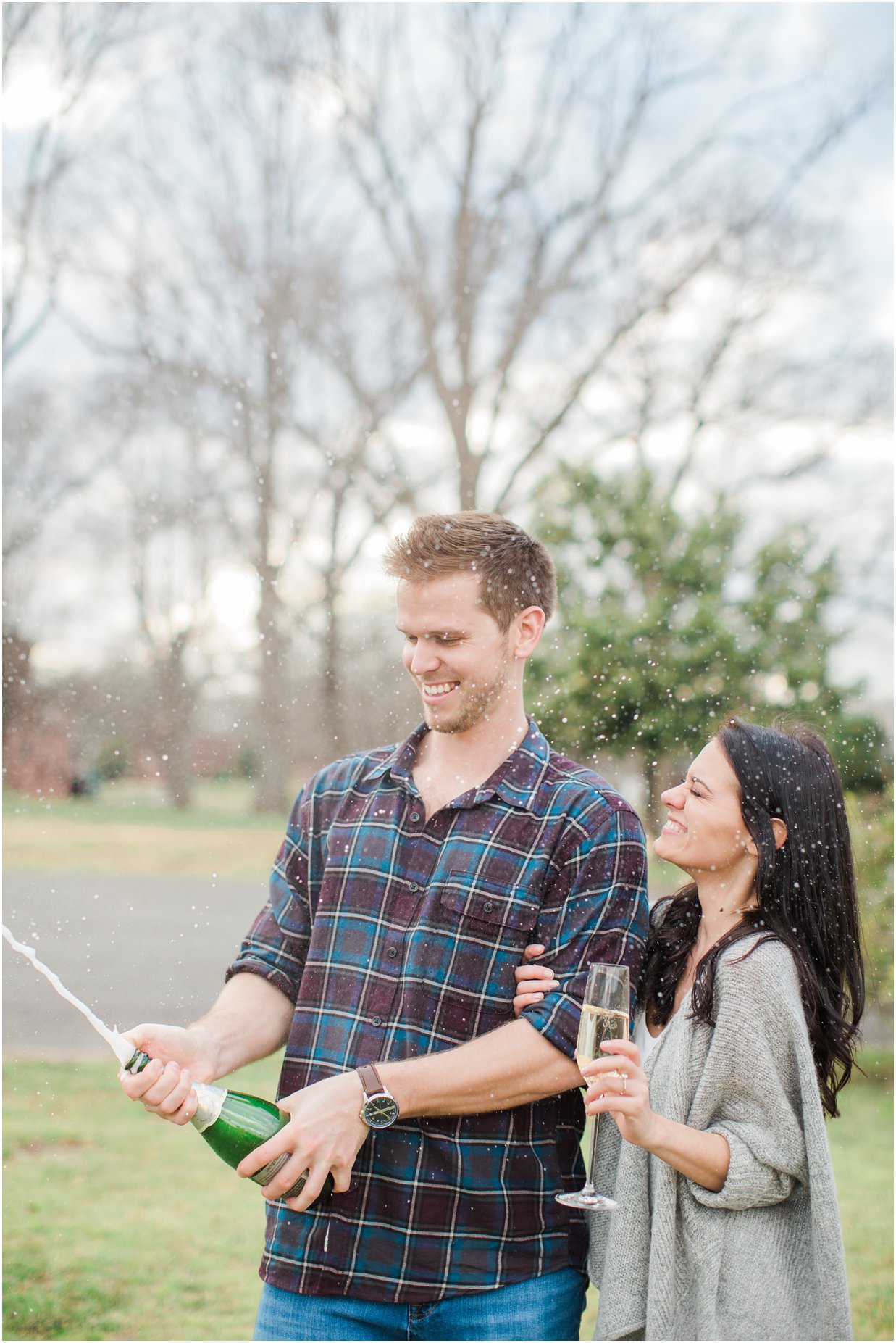 poppin bottles of champagne engagement photos 